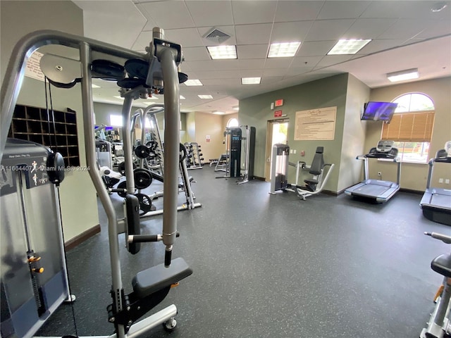 gym featuring a drop ceiling