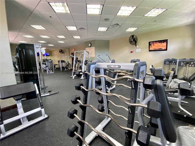 workout area with a paneled ceiling