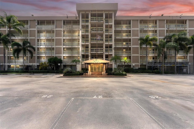 view of outdoor building at dusk