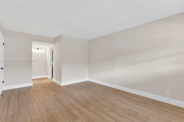 spare room featuring light hardwood / wood-style floors