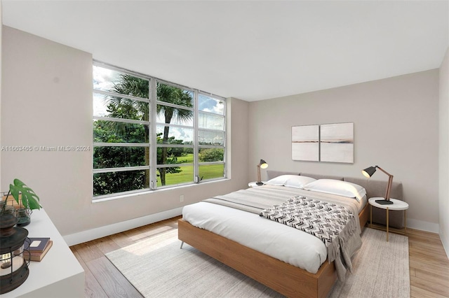 bedroom with light hardwood / wood-style floors