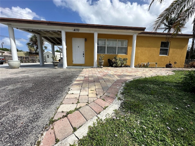 view of front of home featuring a carport