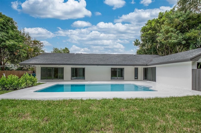 view of pool with a yard and a patio area