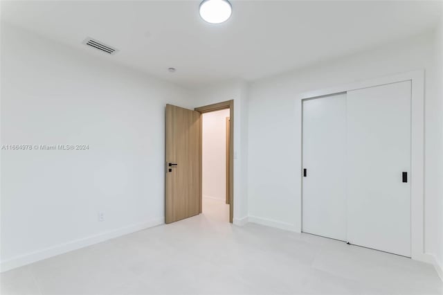 unfurnished bedroom with a closet