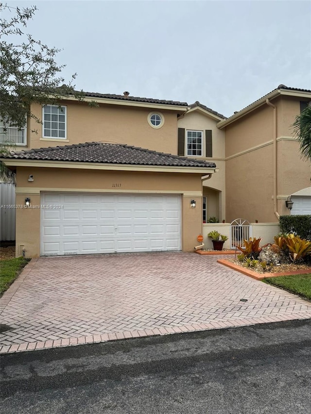 front of property with a garage