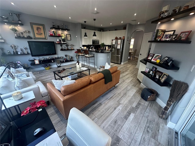 living room with light hardwood / wood-style floors