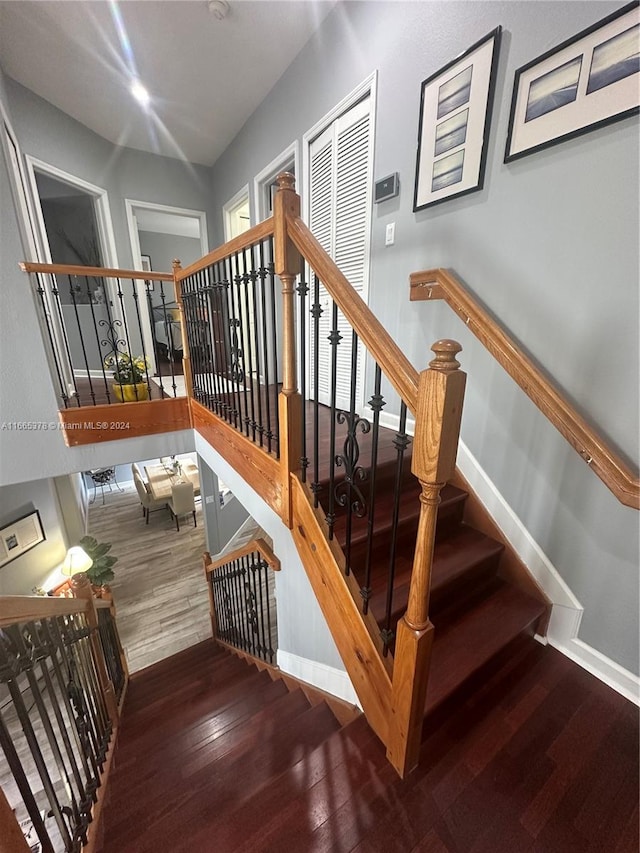 stairs with wood-type flooring