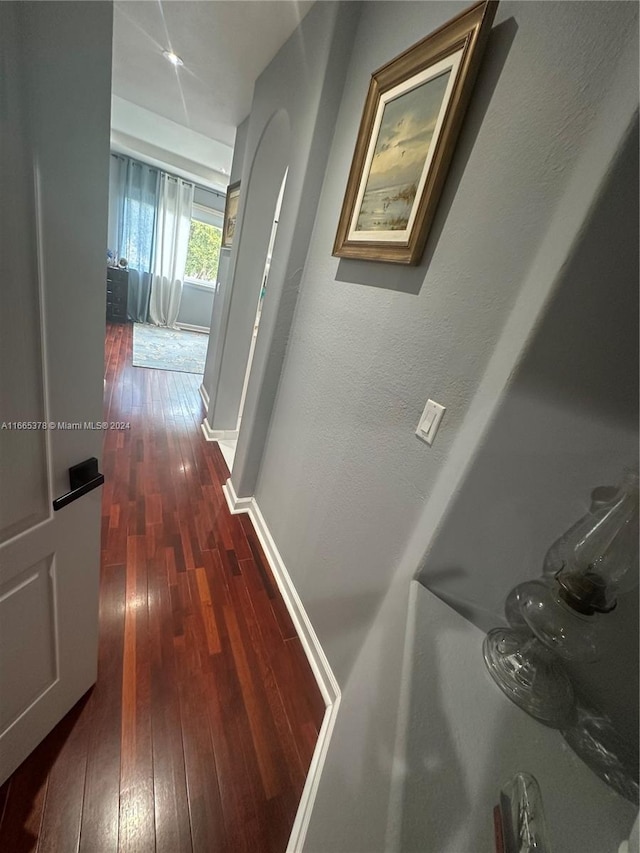 hall with dark wood-type flooring