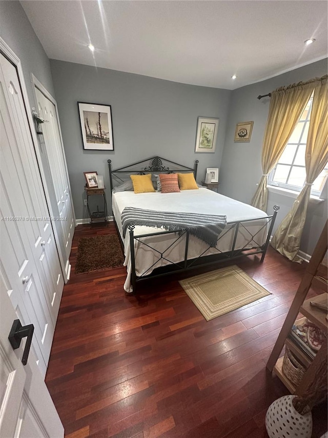 bedroom featuring dark hardwood / wood-style flooring