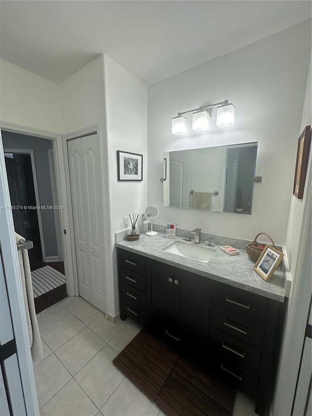 bathroom featuring tile patterned floors and vanity