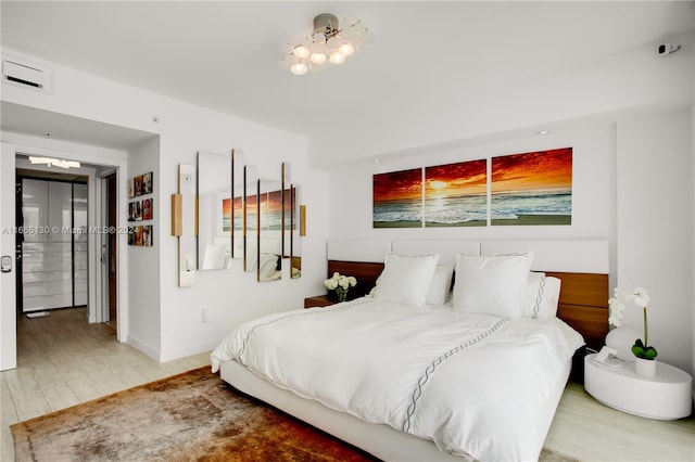 bedroom with hardwood / wood-style flooring