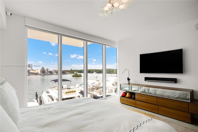 bedroom featuring multiple windows and access to outside