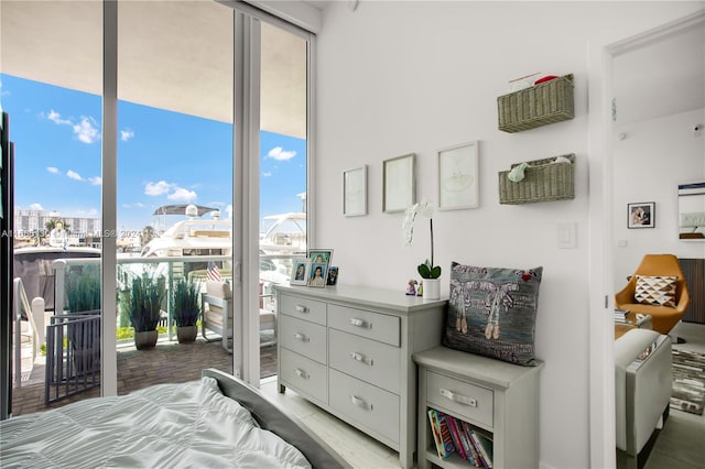 bedroom featuring access to outside and hardwood / wood-style floors