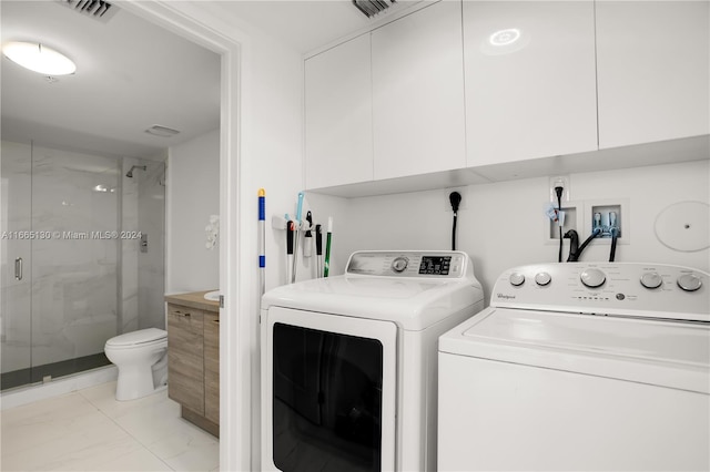 laundry area with washing machine and dryer