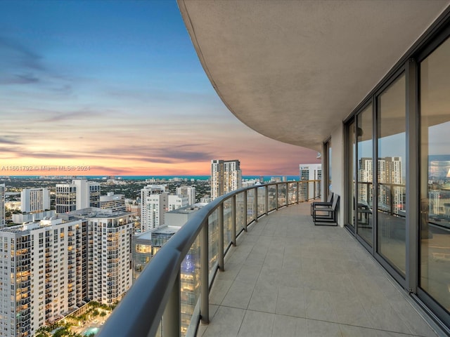 view of balcony at dusk