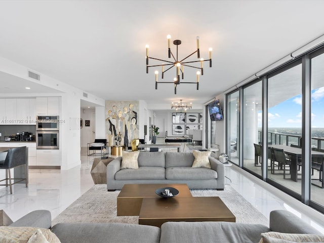 living room featuring expansive windows and a chandelier