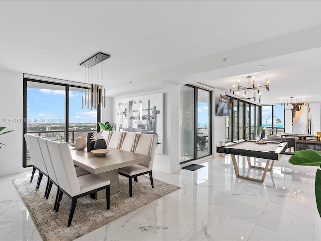 dining space featuring an inviting chandelier, billiards, and expansive windows