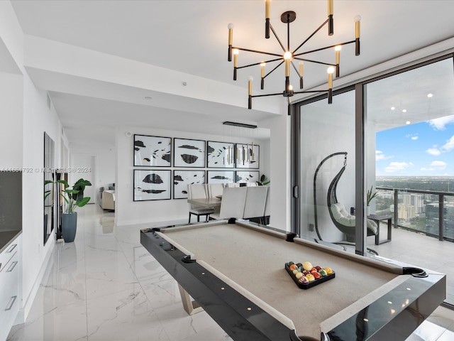 game room featuring pool table and a notable chandelier