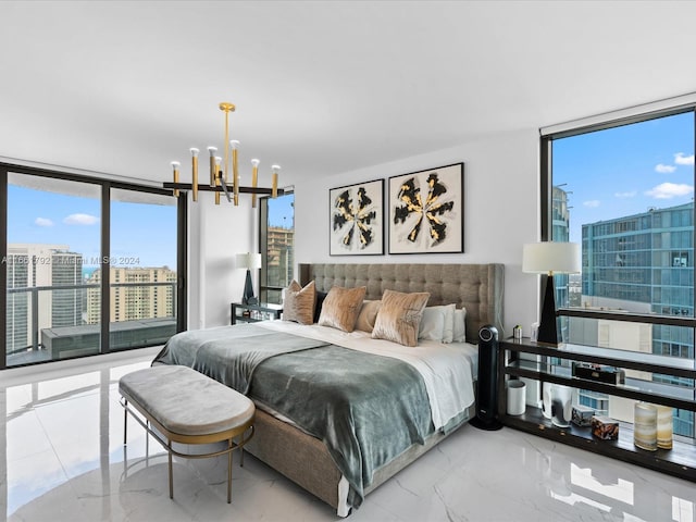 bedroom with a wall of windows and a notable chandelier