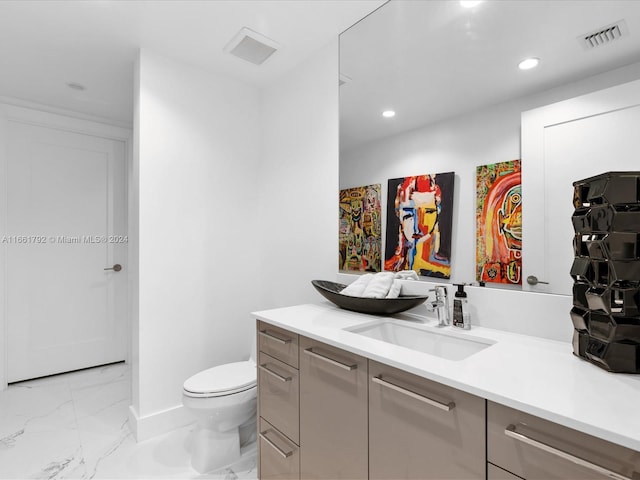 bathroom with vanity and toilet