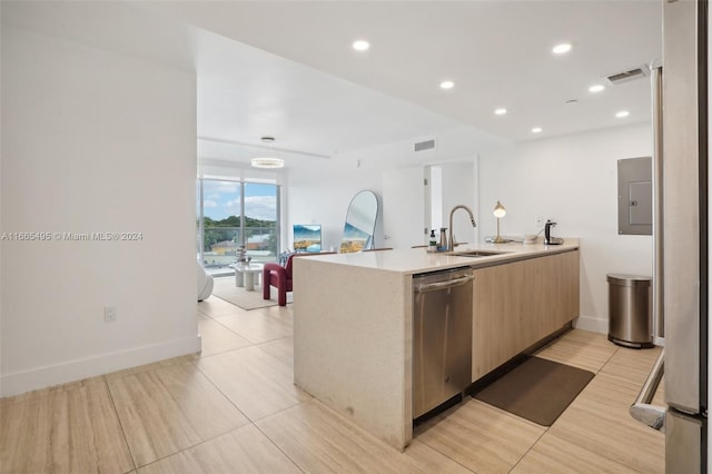 kitchen with light brown cabinetry, dishwasher, sink, and electric panel