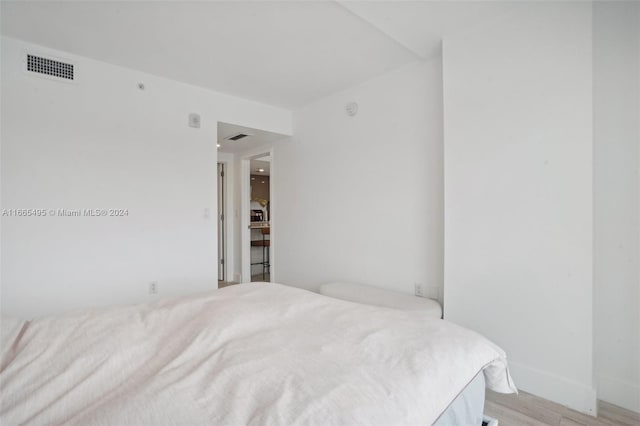 bedroom with light wood-type flooring