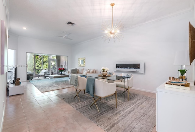 dining room featuring ceiling fan with notable chandelier, crown molding, and light tile patterned floors