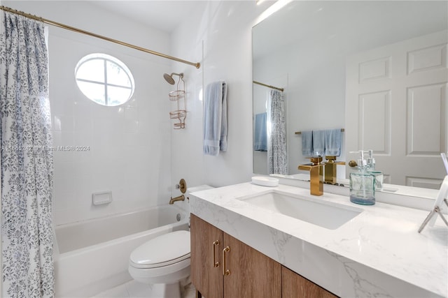 full bathroom featuring vanity, shower / bath combo with shower curtain, toilet, and tile patterned floors