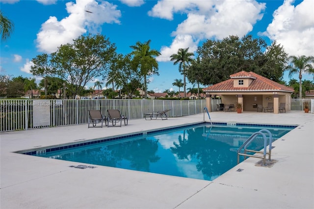 view of swimming pool with a patio area