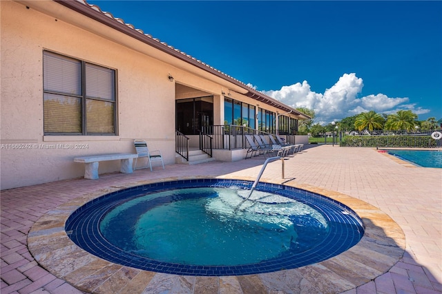 view of swimming pool featuring a patio area