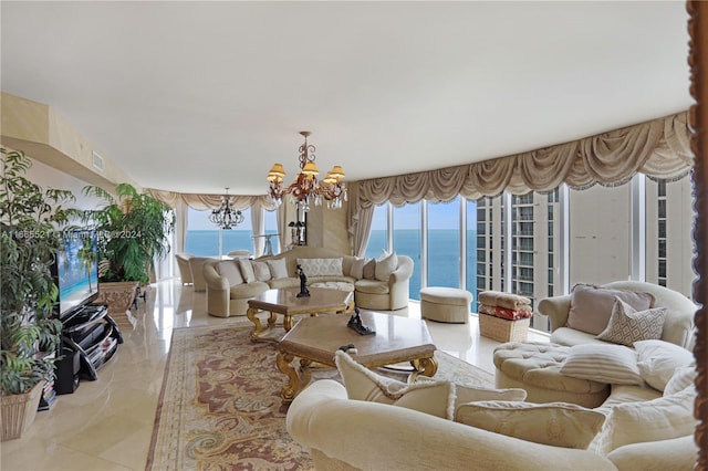 tiled living room featuring a water view and a chandelier