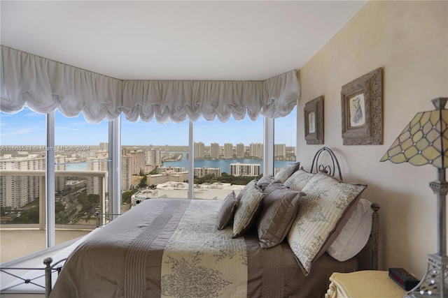 bedroom featuring a water view