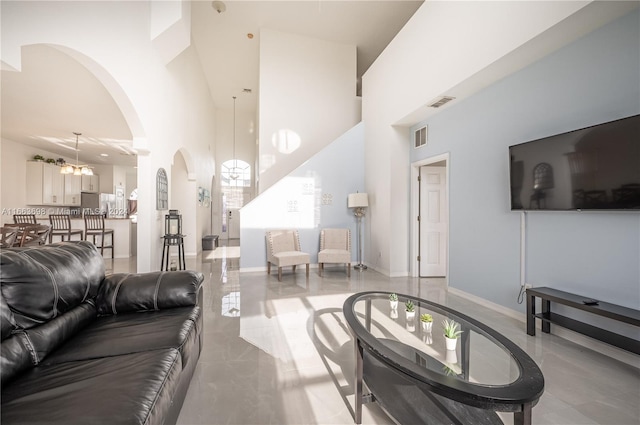 living room with a high ceiling