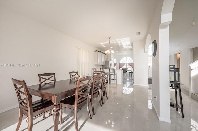 dining area with an inviting chandelier