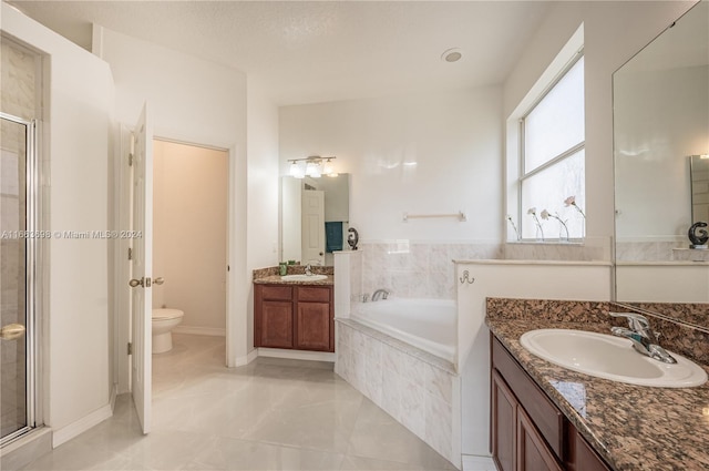 full bathroom with vanity, toilet, and independent shower and bath