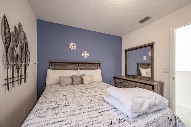 bedroom featuring a textured ceiling