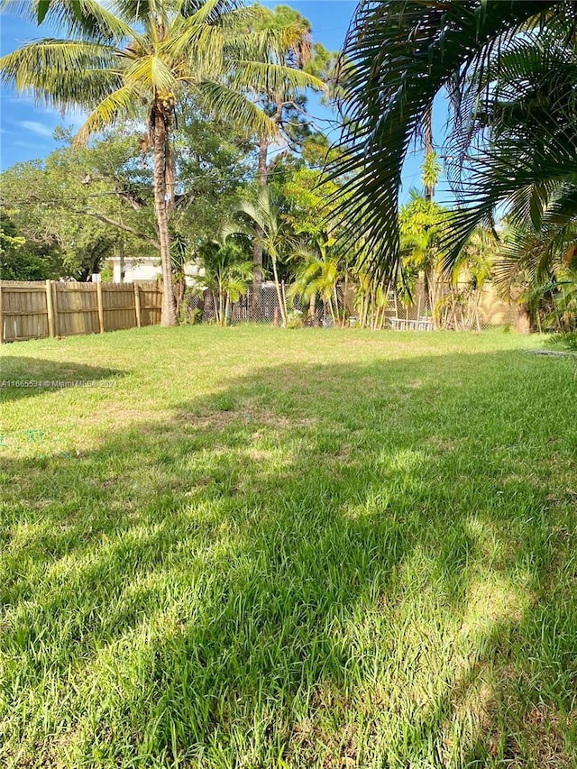 view of yard featuring fence
