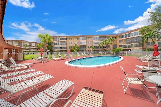 view of swimming pool featuring a patio area