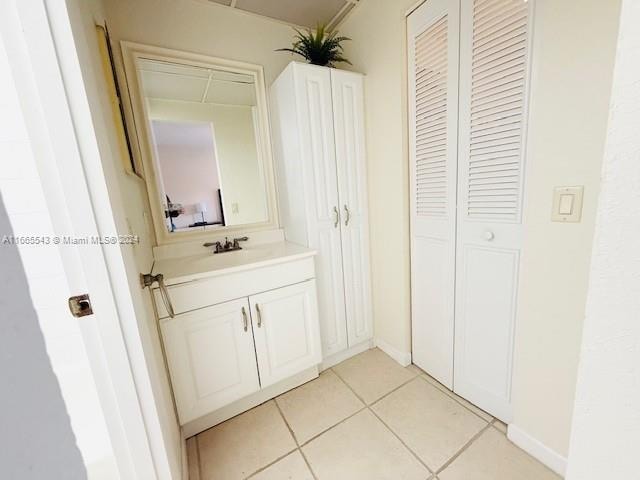 bathroom with vanity and tile patterned floors