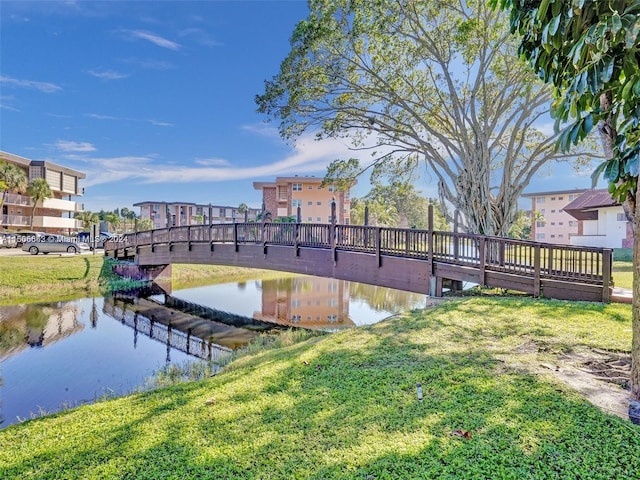 exterior space with a lawn and a water view