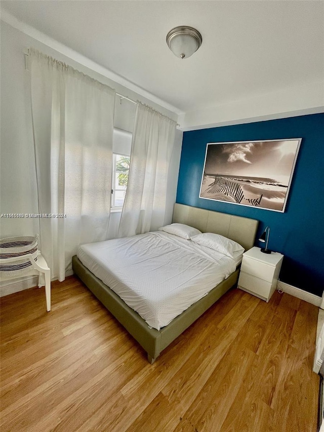 bedroom with light hardwood / wood-style flooring