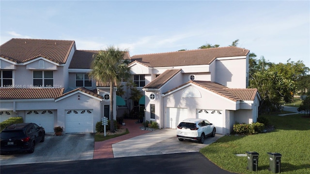 view of front of house featuring a front yard and a garage