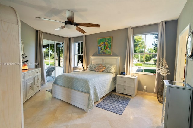 bedroom featuring access to outside, light tile patterned flooring, and ceiling fan