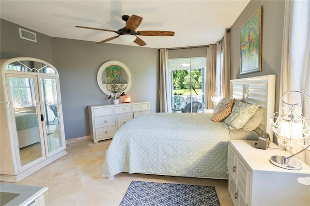 bedroom with access to outside, light tile patterned flooring, and ceiling fan