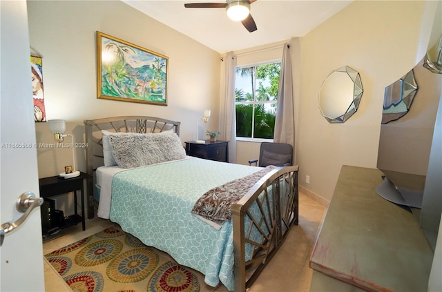 bedroom with ceiling fan and light carpet