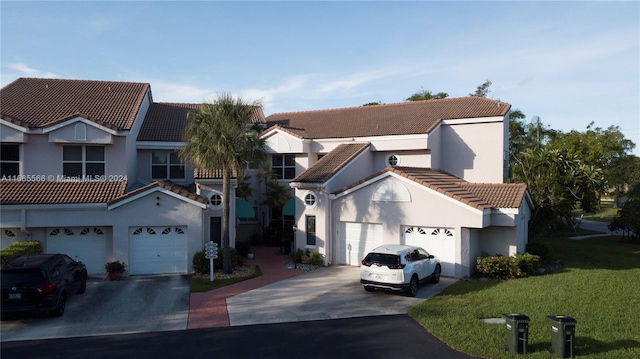 view of front of home with a garage and a front yard