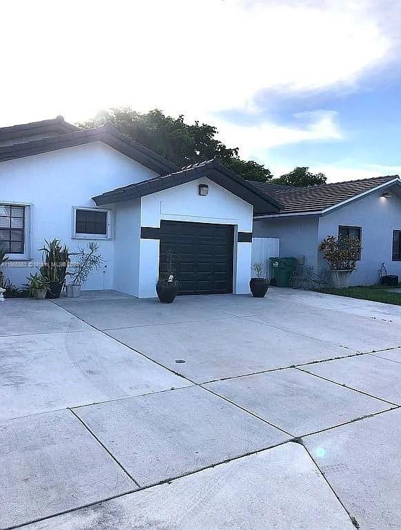 view of property exterior featuring a garage