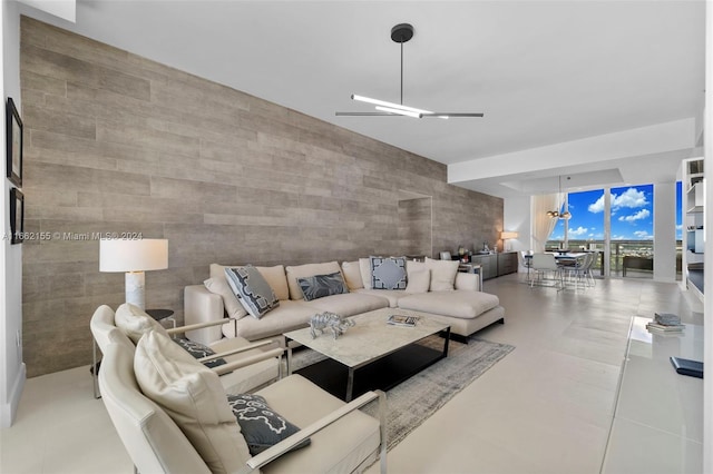 tiled living room with tile walls and floor to ceiling windows