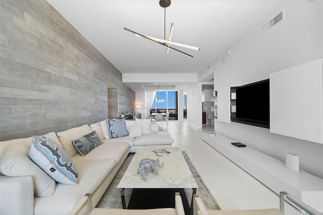 living room with tile walls and concrete floors