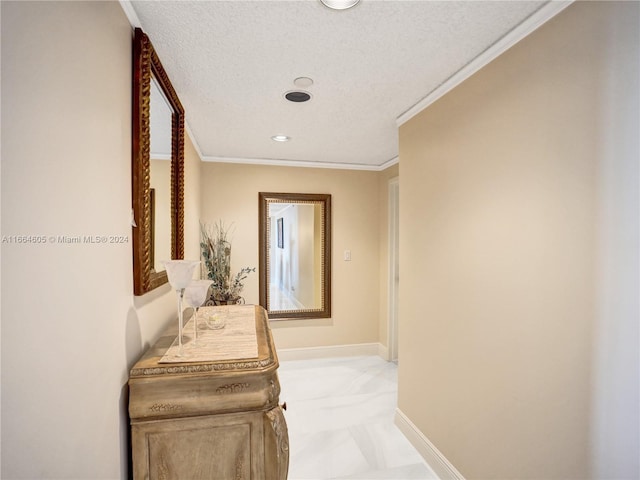 corridor featuring a textured ceiling and ornamental molding